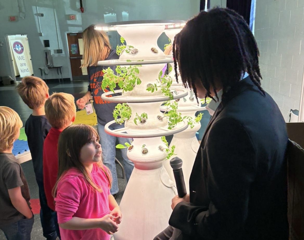 Malon E.D. James teaches youth about hydroponics.jpg
